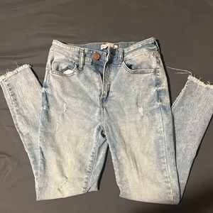 Light blue jeans with rips in knees